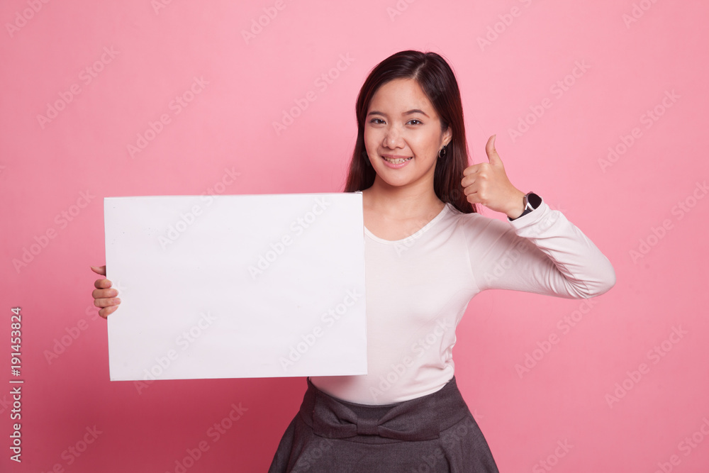 Young Asian woman show thumbs up with white blank sign. Young Asian woman show thumbs up with white blank sign.