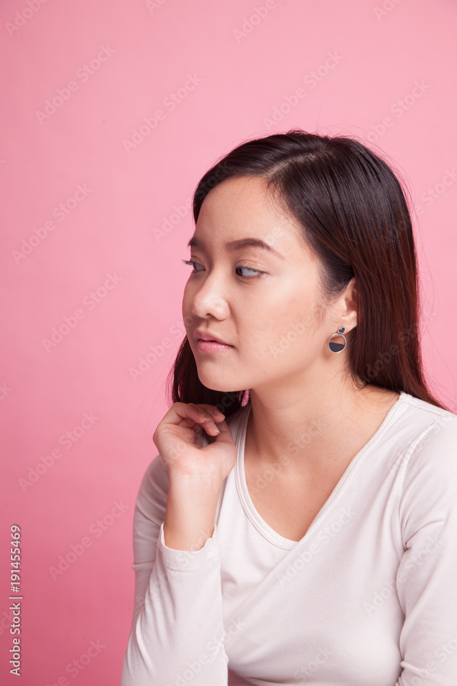 Beautiful young Asian woman on pink background Beautiful young Asian woman on pink background