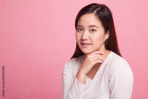 Beautiful young Asian woman on pink background © halfbottle
