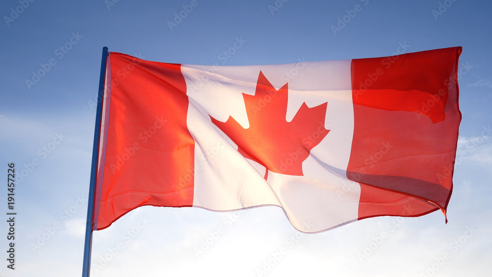 Obraz premium Canada flag on clear blue sky