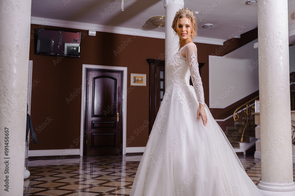Beautiful bride in wedding dress interior