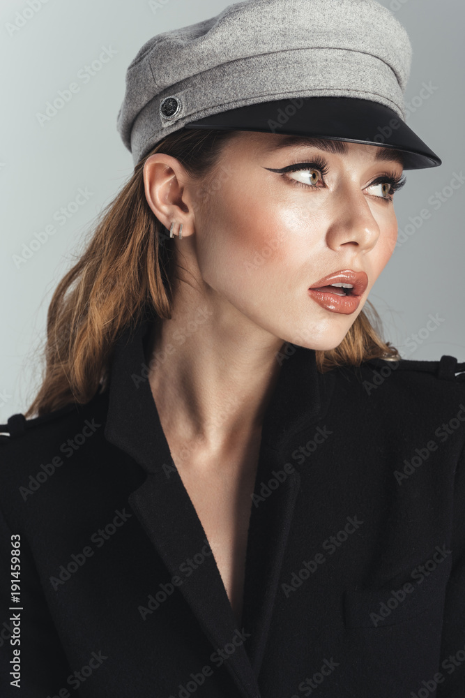 Fashion portrait of a pretty stylish curly brown haired woman Fashion portrait of a pretty stylish curly brown haired woman