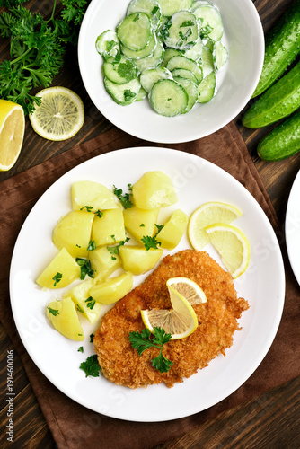 Schnitzel with boiled potato, top view