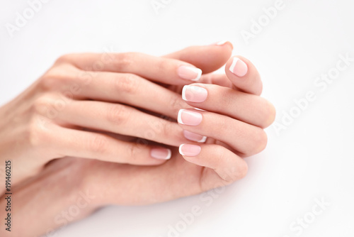 Beautiful woman hands with french manicure photo