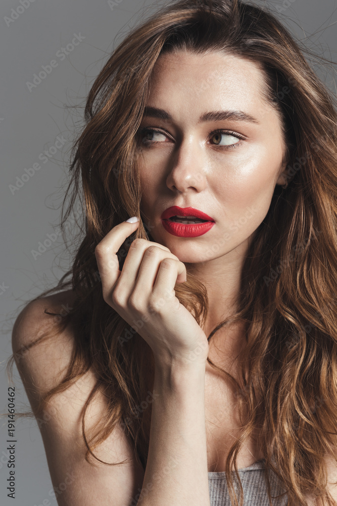 Fashion portrait of an attractive shirtless curly brown hair woman Fashion portrait of an attractive shirtless curly brown hair woman