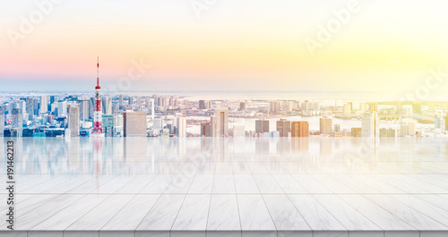 Photography Business concept - Empty marble floor top with panoramic modern cityscape building bird eye aerial view under sunrise and morning bright sky of Tokyo, Japan, for display or montage product