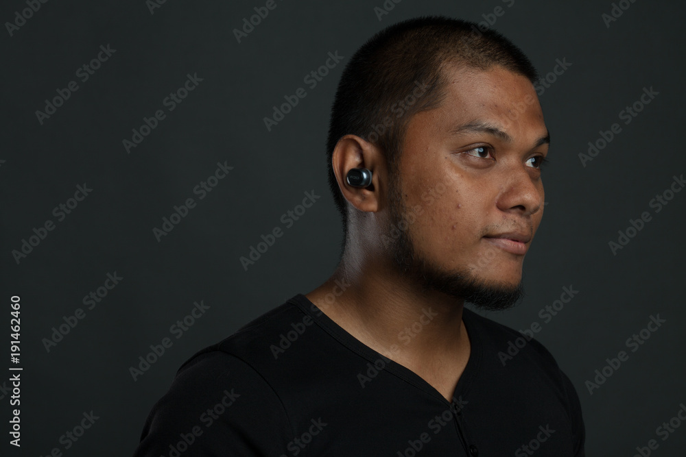 man using gadget with different expression in gray background man using gadget with different expression in gray background