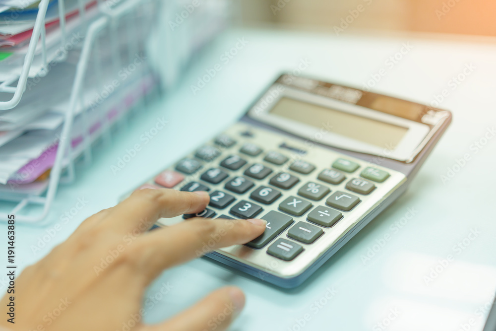 Calculator with hand's woman.woman hand using calculator. Calculator with hand's woman.woman hand using calculator.