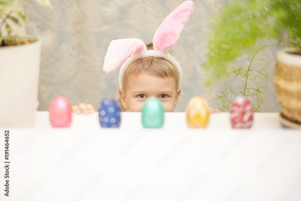 little boy with easter bunny ears and eggs little boy with easter bunny ears and eggs