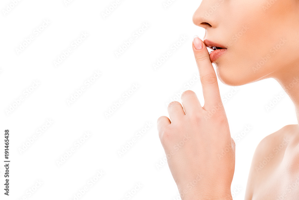 cropped view of girl with hush sign, isolated on white cropped view of girl with hush sign, isolated on white