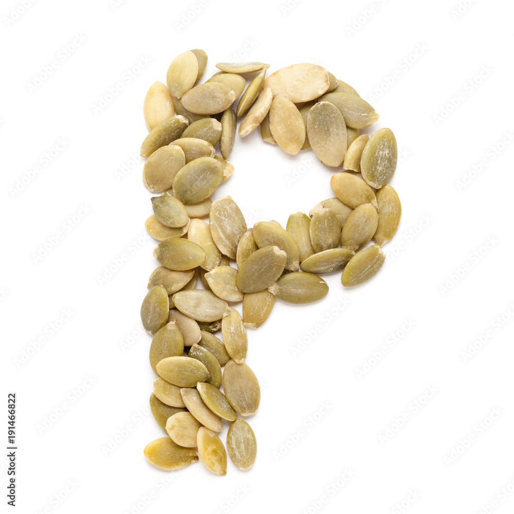 Organic Pumpkin seed (Cucurbita pepo) in P Shape for protein. Isolated on White Background. Micro Closeup, Top view. Organic Pumpkin seed (Cucurbita pepo) in P Shape for protein. Isolated on White Background. Micro Closeup, Top view.