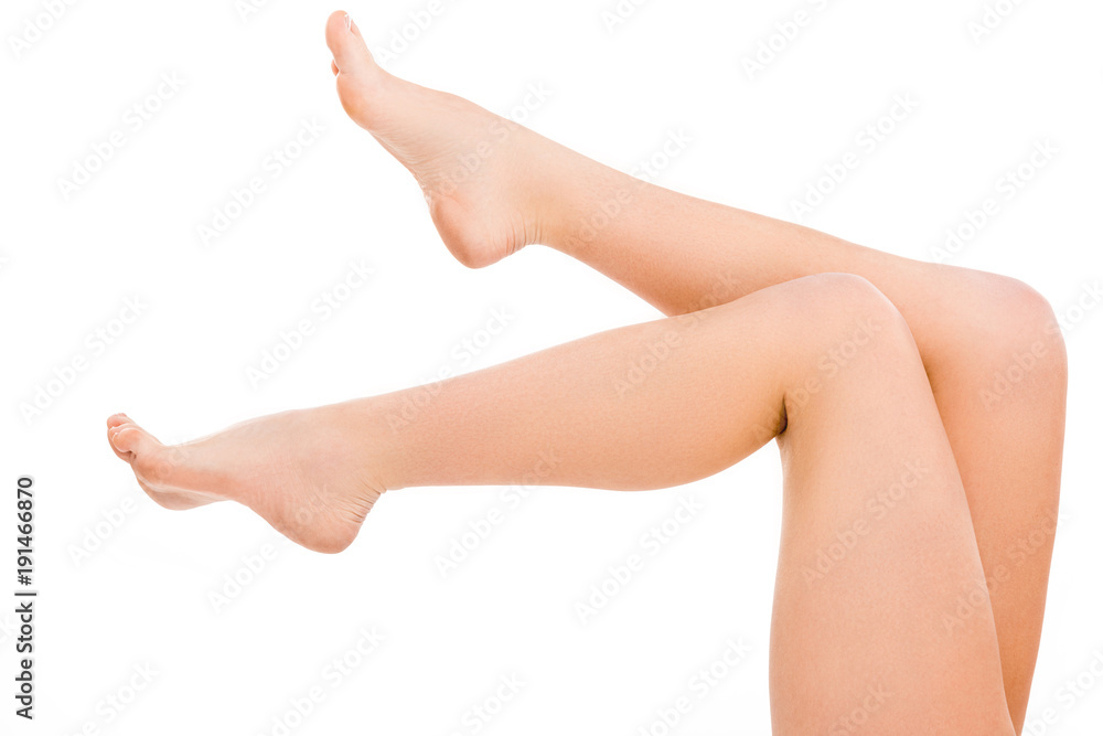 cropped view of barefoot legs, isolated on white