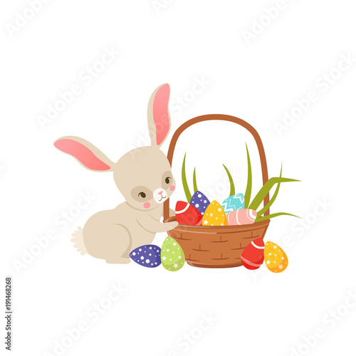 Cute cartoon bunny and basket full of colored eggs, funny rabbit character, Happy Easter concept cartoon vector Illustration