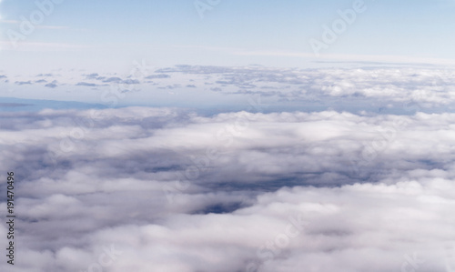 Fototapeta Naklejka Na Ścianę i Meble -  Sunrise above clouds from airplane window