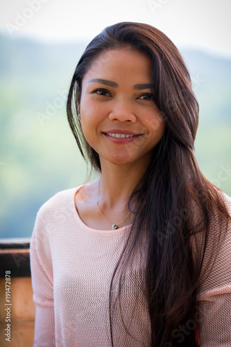 Young smiling girl outdoors. 