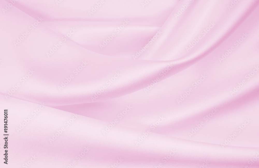Fototapeta premium Smooth elegant pink silk or satin texture as wedding background. Luxurious valentine day background design