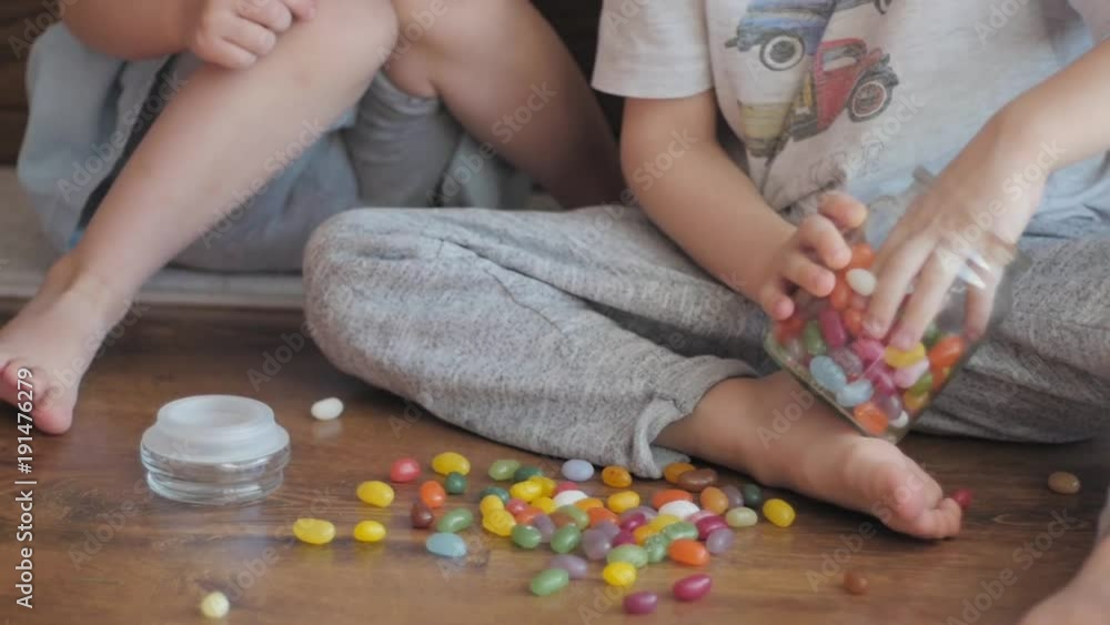 kids playing with colorful candies kids playing with colorful candies