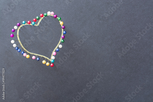 Heart shape from colored pins.