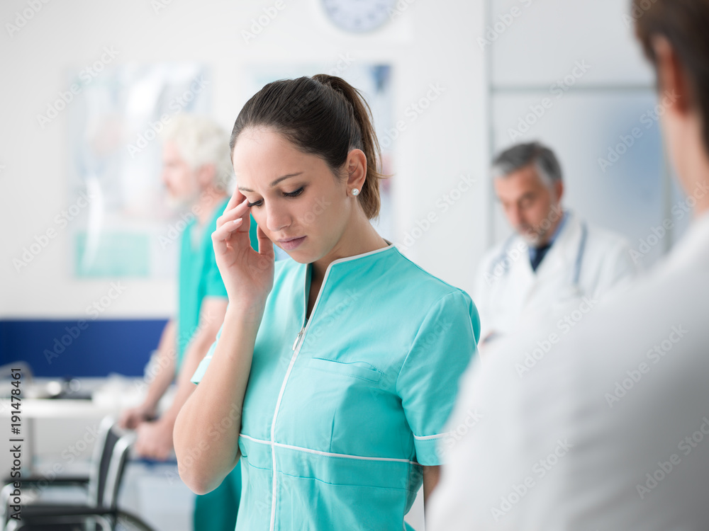 Healthcare worker having an headache Healthcare worker having an headache