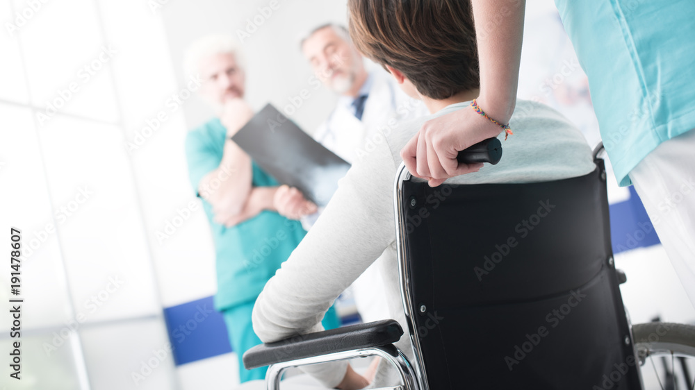 Fototapeta premium Doctors checking a disabled patient's x-ray