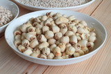 Dry lotus seed in white plate.