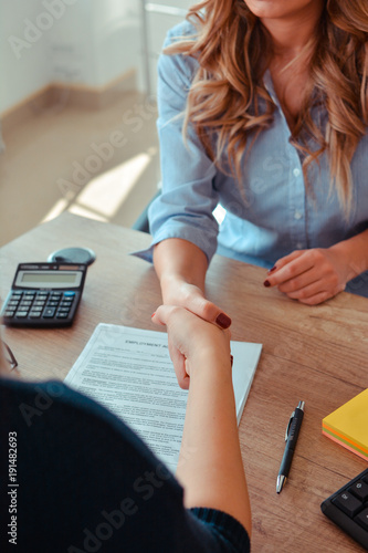 Woman offer Handshake to seal a deal after a job recruitment meeting