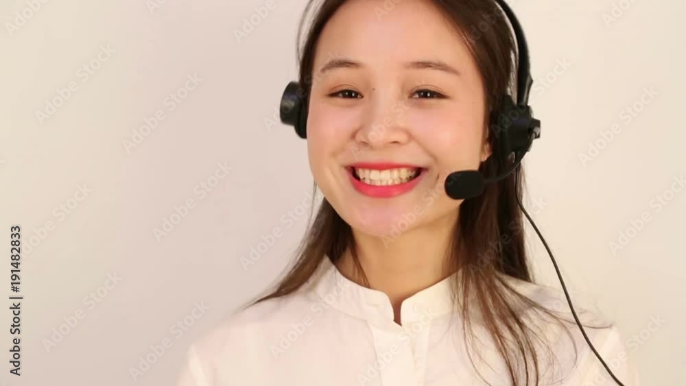 Customer service and support woman talking on the phone against a white background Customer service and support woman talking on the phone against a white background