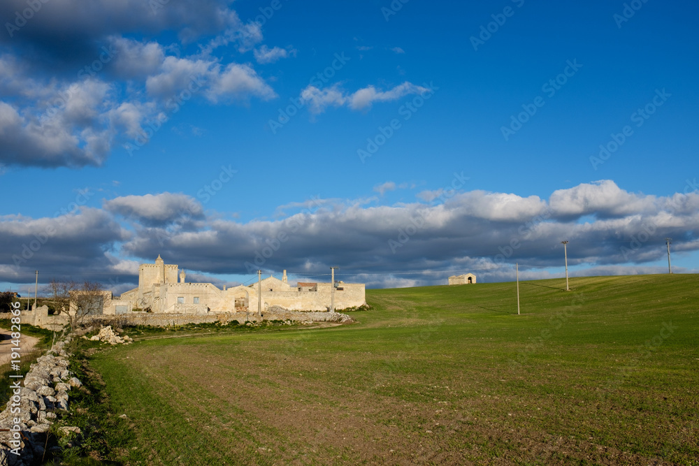 Typical Murgia landscape with an old manor farm and drystone walls. Apulia, Italy.