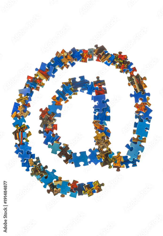 Symbol @ made of puzzle pieces - internet concept Symbol @ made of puzzle pieces - internet concept