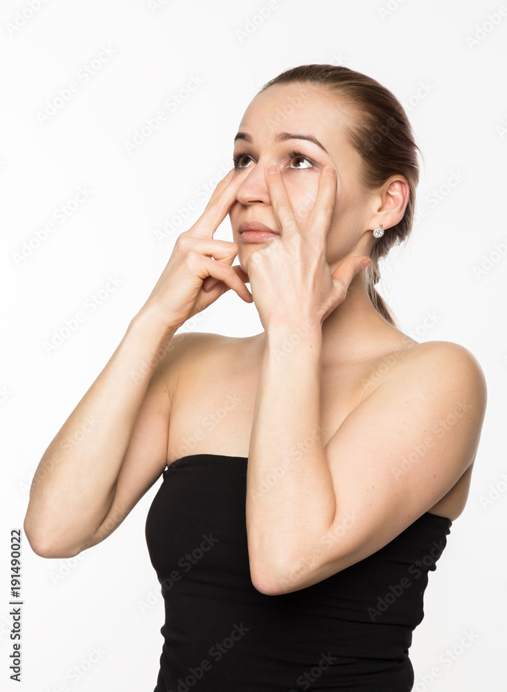 gymnastics for a face, woman doing anti-aging exercises. beauty and health concept gymnastics for a face, woman doing anti-aging exercises. beauty and health concept