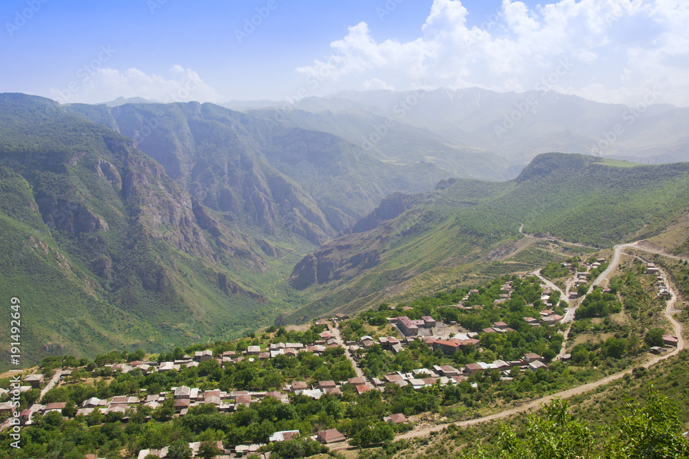 A view of the village of Alidzor, the mountains and the gorge. The blue summer sky. Beautiful scenery, Armenia.