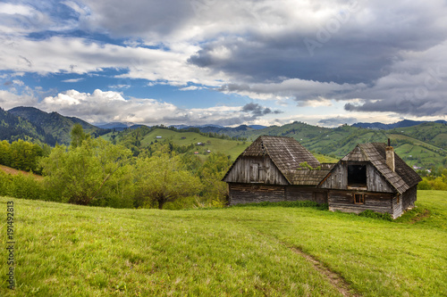 Mountain farm with old wooden house near Bran, Transylvania,