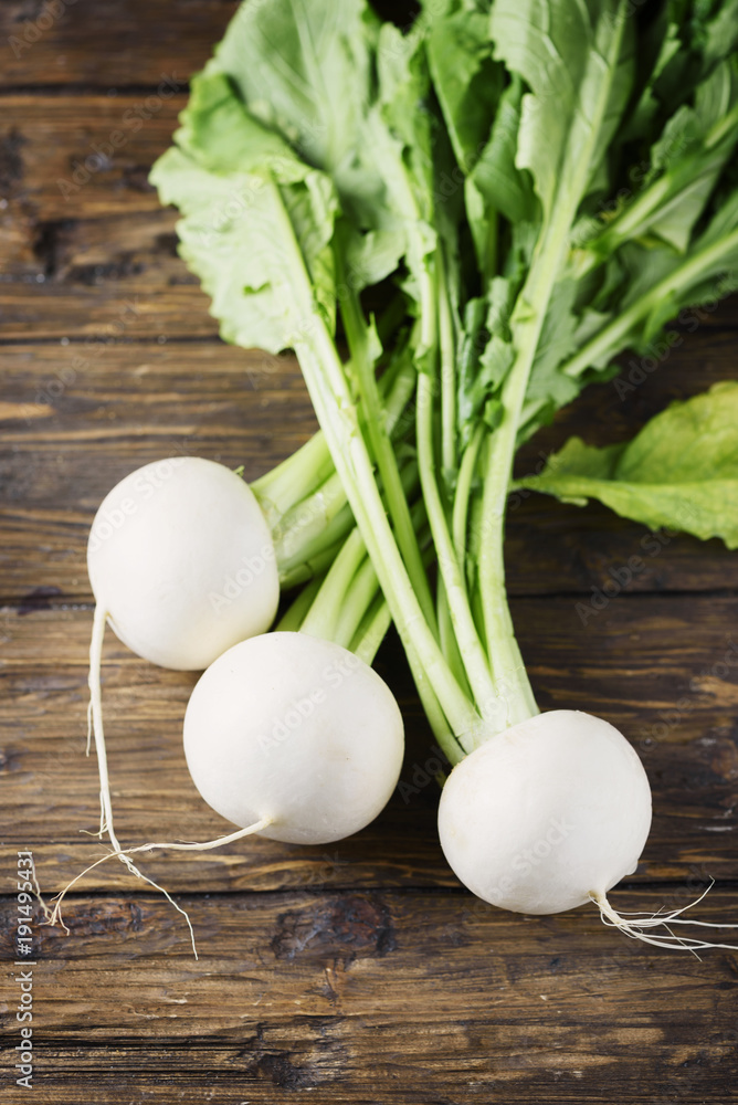 White fresh turnip on the wooden table White fresh turnip on the wooden table