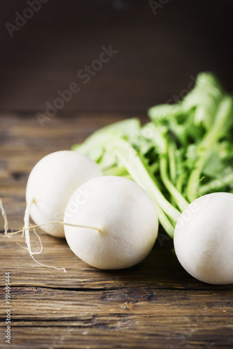 White fresh turnip on the wooden table photo