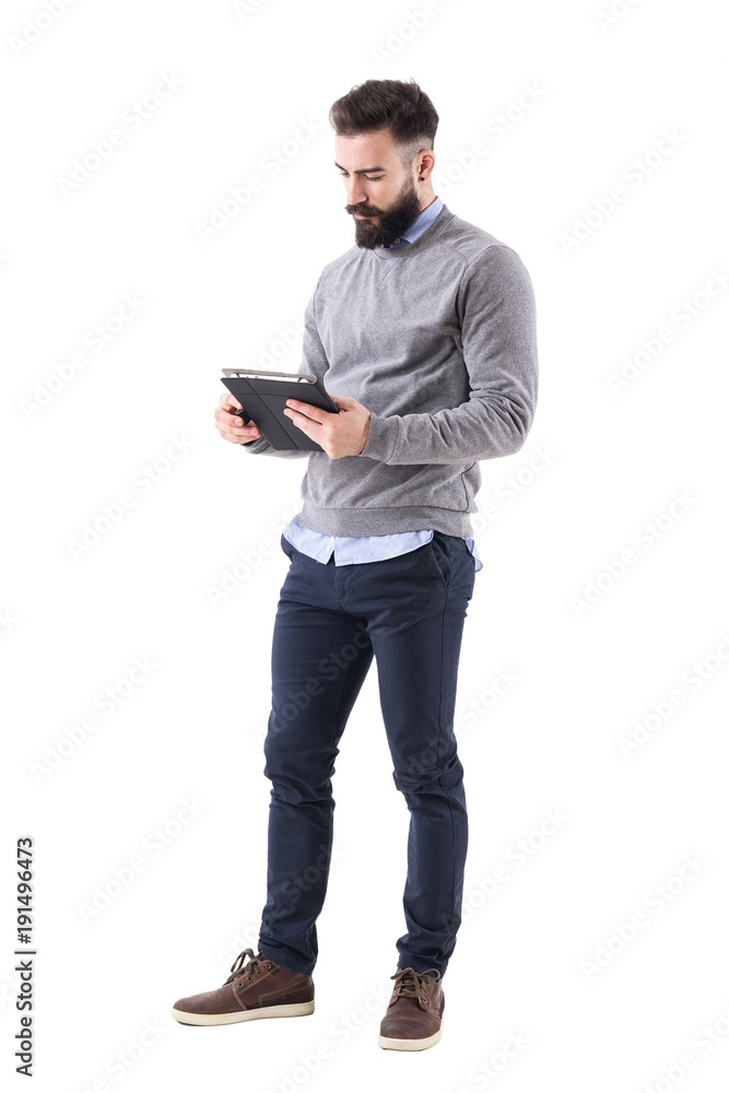 Serious bearded businessman or teacher reading notebook paper. Full body length portrait isolated on white studio background. Serious bearded businessman or teacher reading notebook paper. Full body length portrait isolated on white studio background.