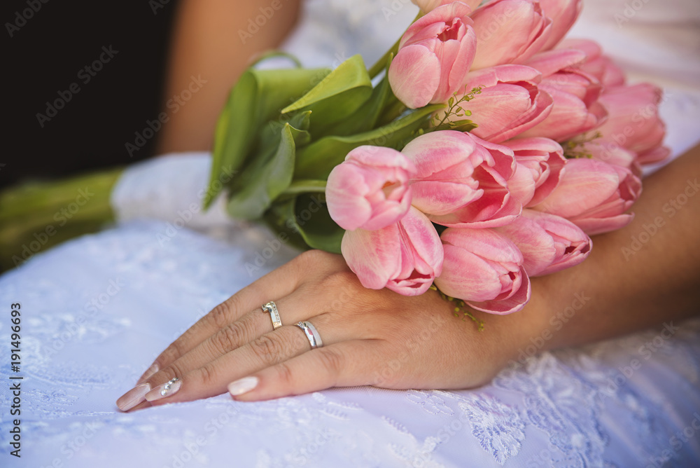 the hands of married couples and the wedding bouquet the hands of married couples and the wedding bouquet