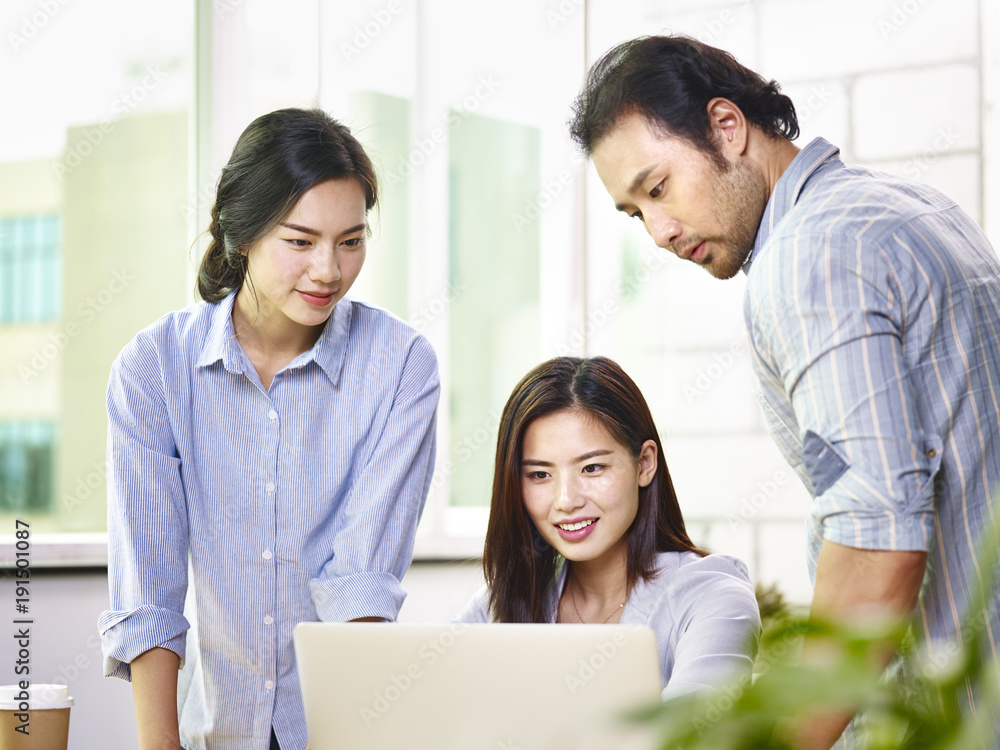 asian team of business people working together in office asian team of business people working together in office