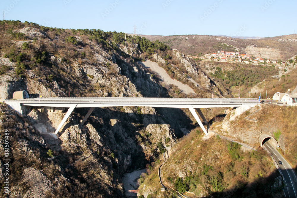 Fototapeta premium Scenic view on motorway tunnel and bridge highway road leading through in Croatia, Europe / Transport and traffic infrastructure / Signs and signaling.