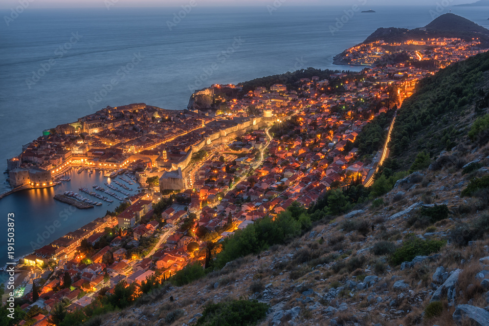 Aerial view of Dubrovnik at night, beautiful illuminated cityscape. The world famous and most visited historic city of Croatia, UNESCO World Heritage site