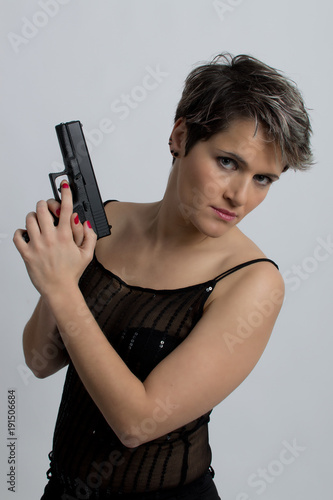 Woman standing with gun