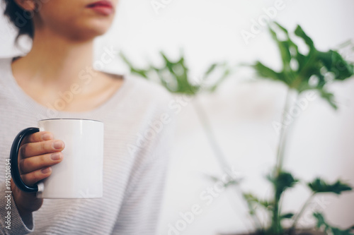 Hand holding coffee cup photo