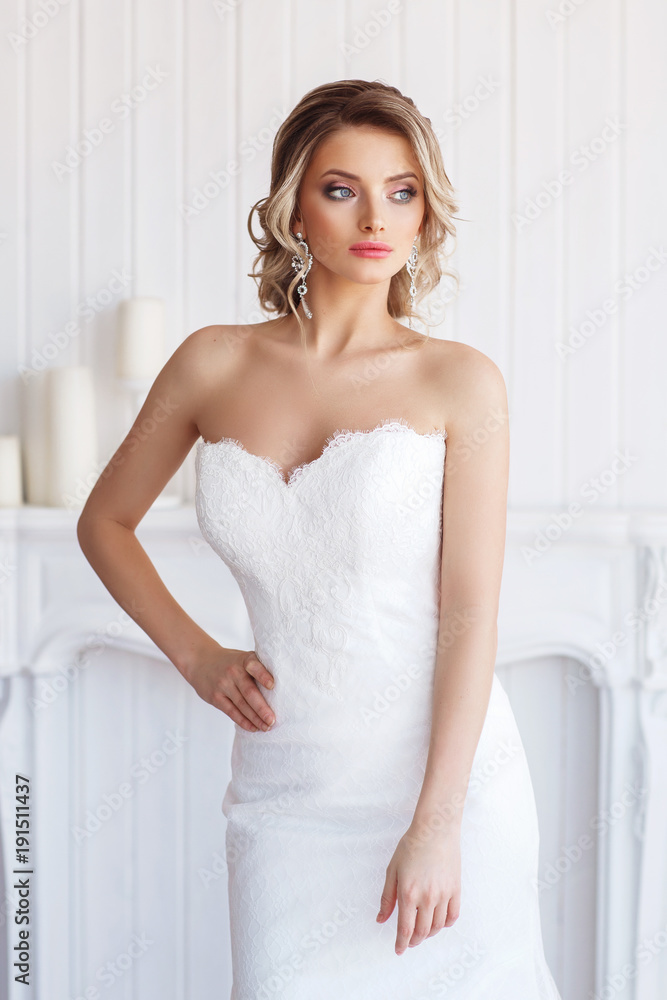 Portrait of a beautiful bride. Blonde girl with curly hair and fashion makeup. Portrait of a beautiful bride. Blonde girl with curly hair and fashion makeup.