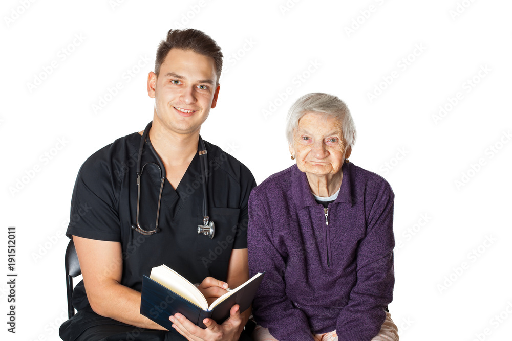 Old woman with carer reading a novel