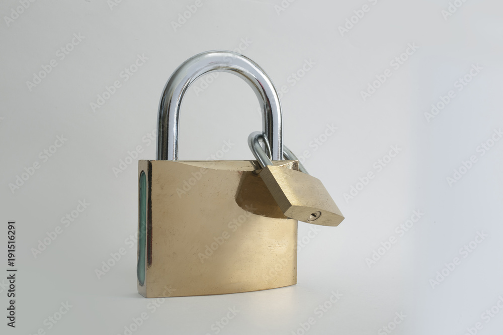 Two interlocked padlocks