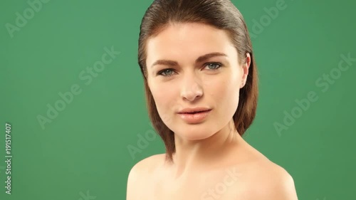 beauty brunette woman on greenback rotating face photo