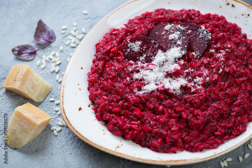 Close-up of risotto with beetroot and parmesan, selective focus, horizontal shot