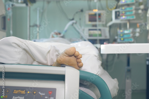 Patient in serious condition connected to the life support devices photo