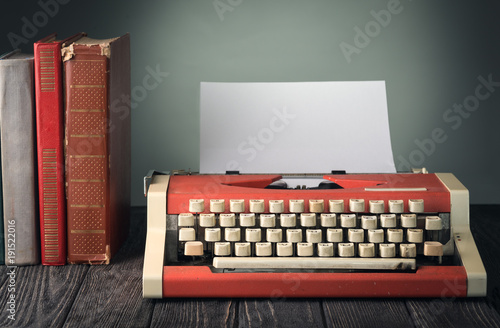 Typewriter and books