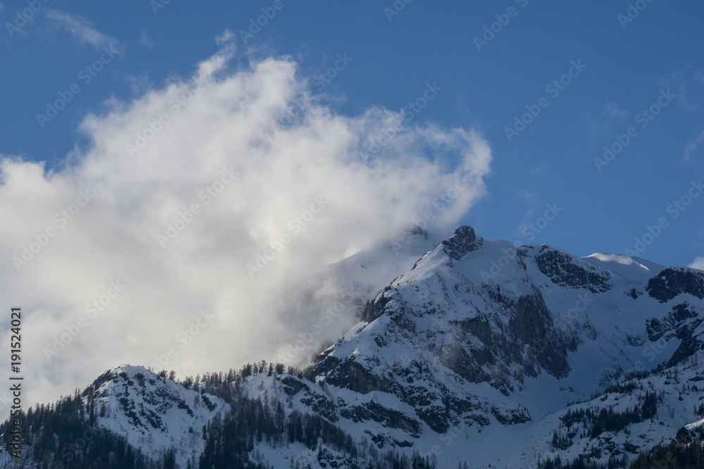 Cloud smashing against the stone barrier of the Austrian Alps