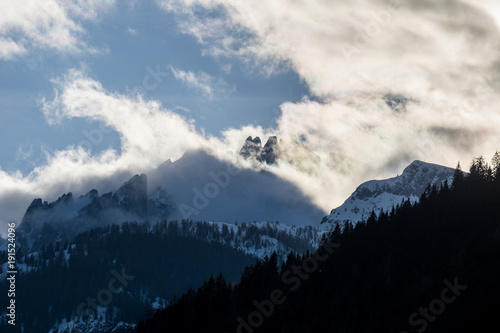 Dramatic limestone mountain scenery with peaks shrouded in clouds © Emil